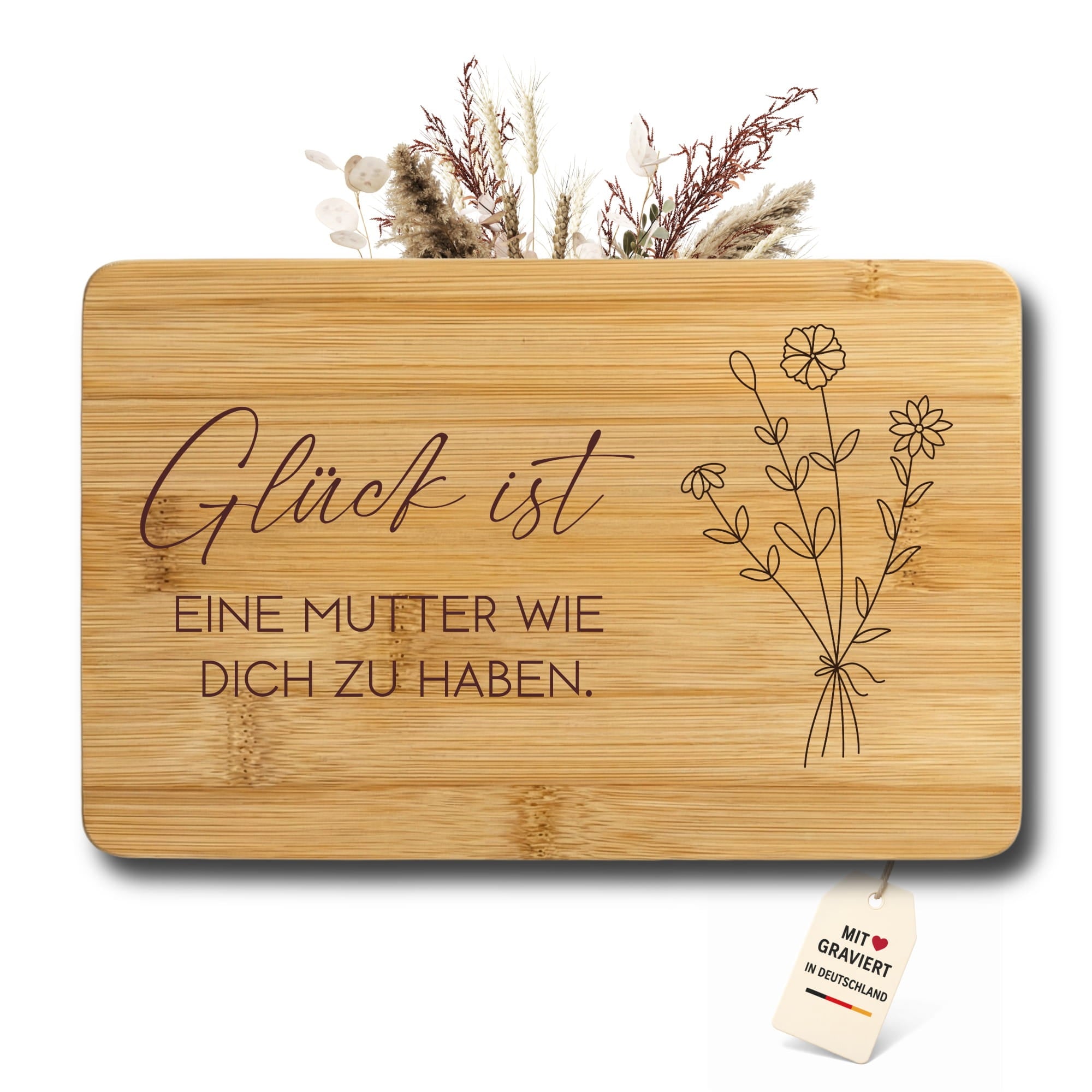 Detailansicht der Lasergravur „Glück ist eine Mutter wie dich zu haben“ auf Bambus Brett
